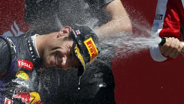 Mark Webber celebrates his second place in the British GP with Fernando Alonso of Spain, who finished third.