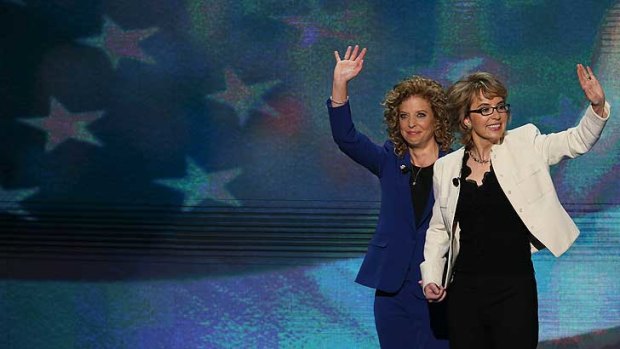 Gabrielle Giffords, left, on stage with Democratic National Committee Chairwoman,  Debbie Wasserman Schultz.