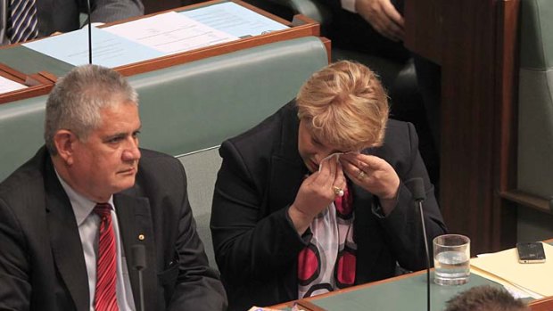 Natasha Griggs wipes her eyes during the debate about the asylum seeker bill.