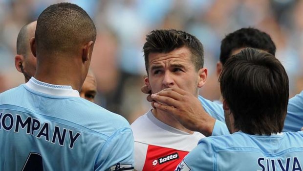 Bigmouth strikes again &#8230; Queens Park Rangers' Joey Barton clashes with Manchester City players after being sent off in their Premier League match.