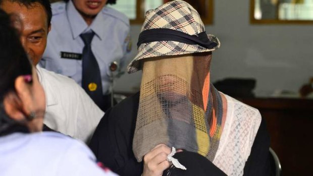 Released from jail: Schapelle Corby covered her face after being released from Kerobokan prison.