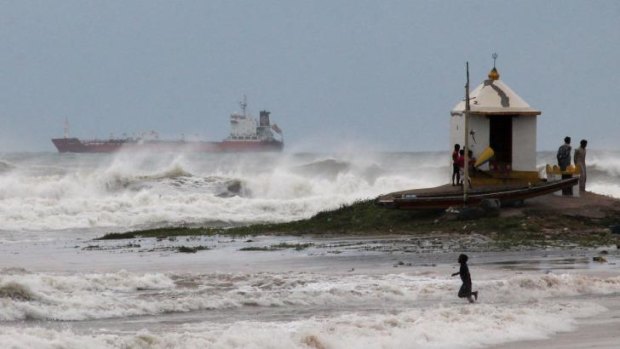 Battered: Large waves hit the beach in Visakhapatnam, India, ahead of Cyclone Hudhud.