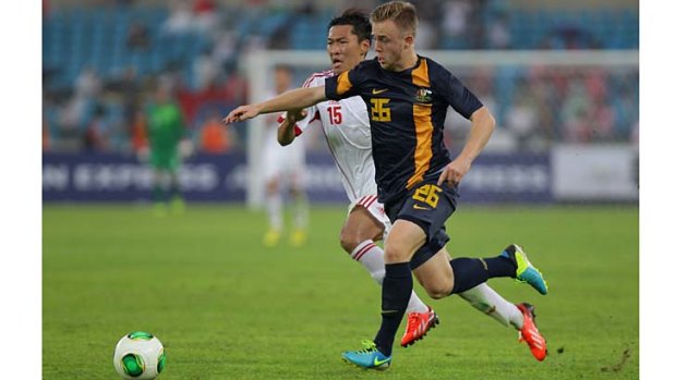 Connor Pain of Australia competes for the ball with Wu Xi of China during the East Asian Cup match in Seoul on Sunday.