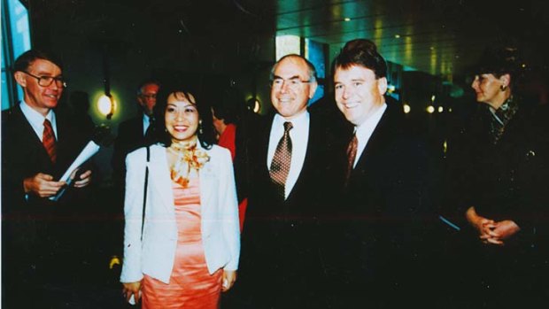Connections: Helen Liu (left) with John Howard and Joel Fitzgibbon.