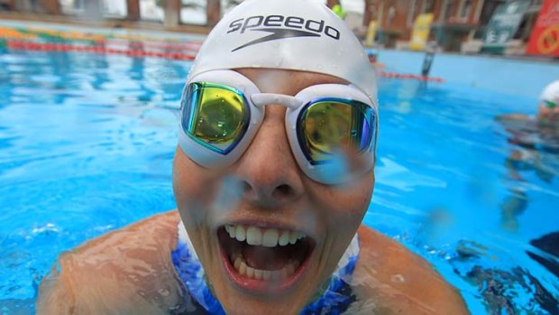 Skinny dip: Leisel Jones tries out the new suit, cap and goggles at their launch yesterday.