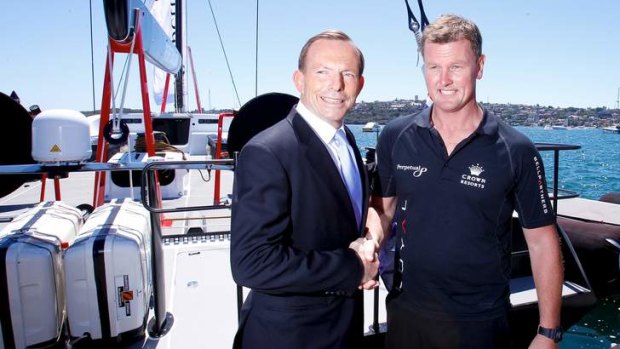 Tony Abbott, posing yesterday for pictures with yacht owner Anthony Bell, was again too busy to answer questions from reporters.