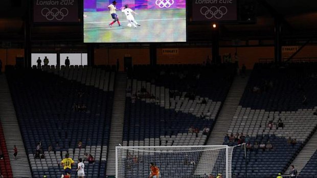 Empty seats are seen in the stands during the women's football.