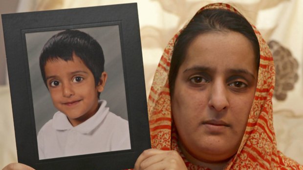 Kidnapped ... Akila Naqqash holds a picture of her five-year-old son Sahil.