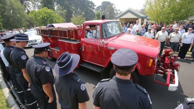 Guard of honour: Mourners pay tribute to professional firefighter Peter Cramerat his funeral in Traralgon on Monday.