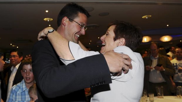 Liberal leader Zed Seselja enters the Liberal post-election party and is greeted by Kate Carnell.