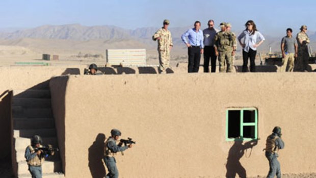 ‘‘Significant progress is being made’’ ... Tony Abbott observes a training exercise of the special operations task group at the Tarin Kowt base in Afghanistan.