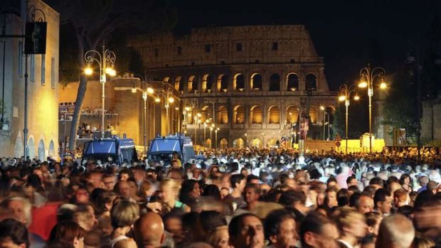 Revellers party on Fori Imperiali in front of the Colosseum to mark the traffic ban.