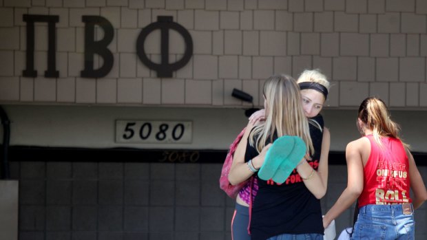 Students console each other outside the Pi Beta Phi Sorority near San Diego State University after news that a student had died.