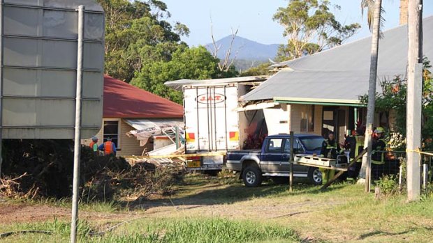 A scene from the crash at Urunga where a truck ploughed into a home after the highway collision.