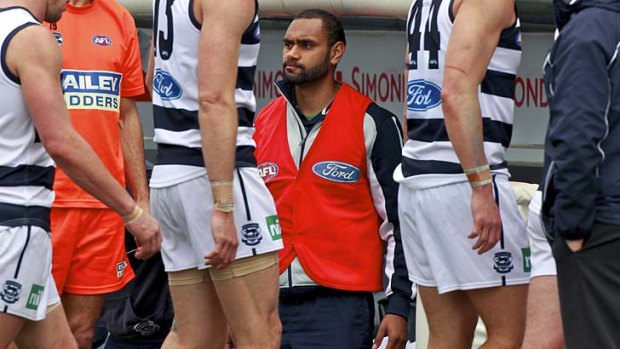 Travis Varcoe on the bench after being subbed out of the game in round 22.