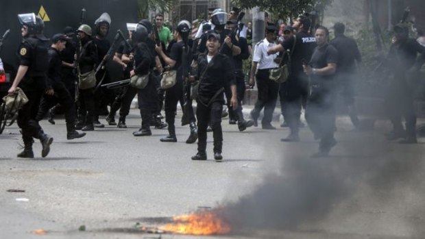 Crackdown: Egyptian riot policemen confront supporters of the Muslim Brotherhood at Cairo University on April 15.