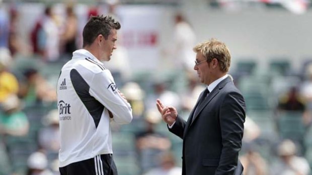 Shane Warne talks to Kevin Pietersen before the fourth day's play in Perth.