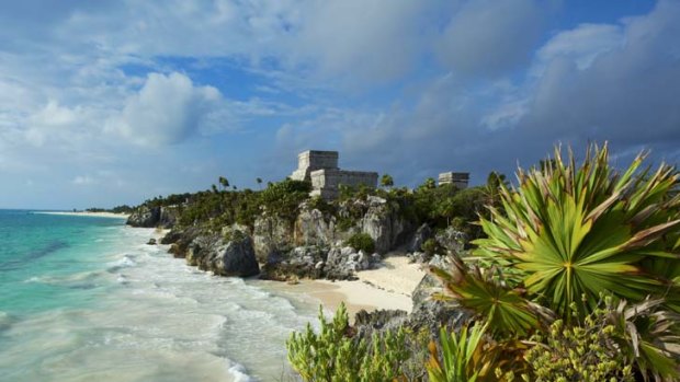 Sands of time ... Mayan ruins overlook an expanse of white beach.