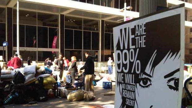 A poster with the slogan "We are the 99%" at the campsite.