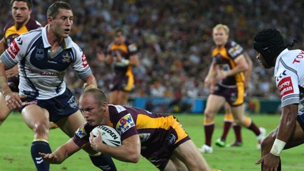 Darren Lockyer dives in for a try for the Broncos in their NRL season opener.