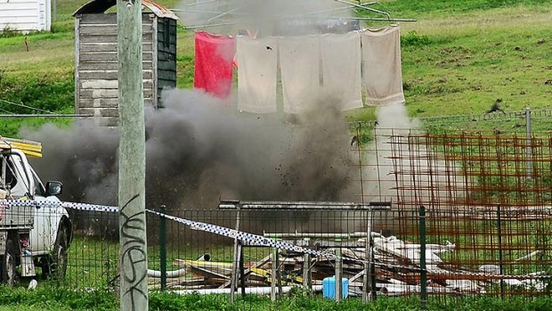 The Police Bomb Squad detonate explosives at a house in West Ipswich.