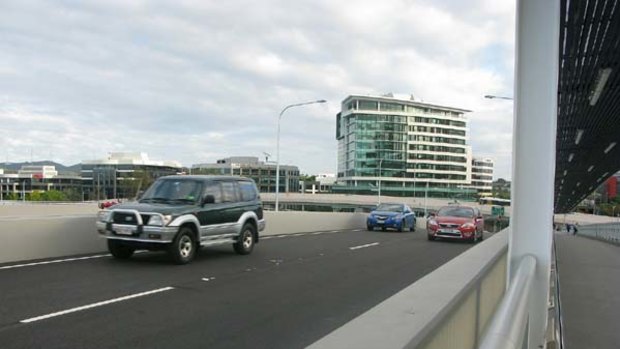 Road test ... motorists take their first drive over the Go Between Bridge.