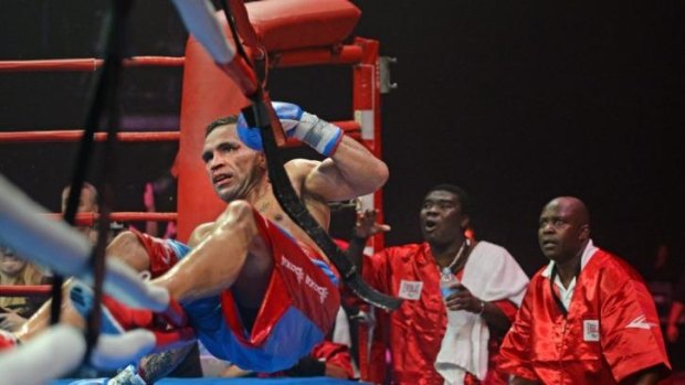 Fighting on: Anthony Mundine climbed off the canvas five times during his loss on Wednesday.