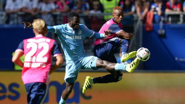 Hamburg's Cleber Reis, right, and Stoke City's Mame Diouf contest the ball in a preseason game. 