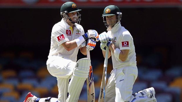 Michael Hussey and Michael Clarke take a breather during the final day of the first Test against South Africa.
