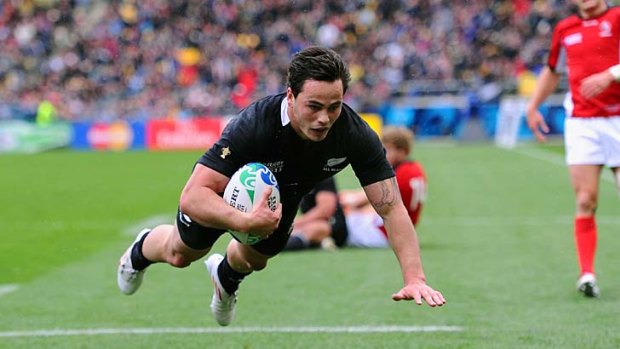 Star winger ... Zac Guildford dives over the line to complete his first-half hat trick during the World Cup match against Canada last month.