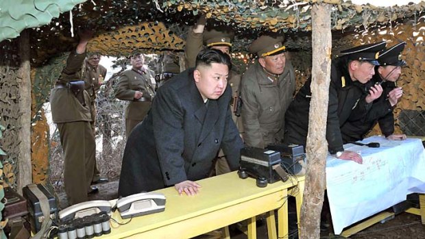 Kim Jong-un watches soldiers of the Korean People's Army taking part in drills.