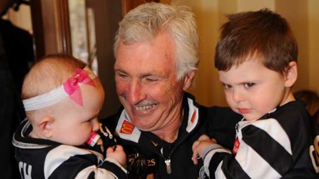 The softer side of Mick Malthouse: with his grandchildren Holly and Zac.