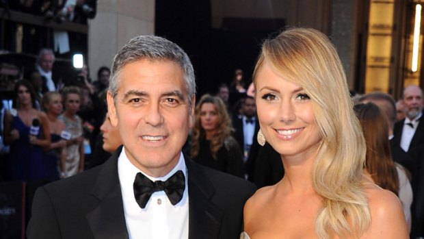 Golden girl ... George Clooney and Stacy Keibler.