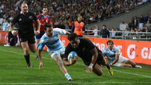 Julian Savea of the All Blacks dives over for his second try.