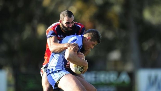 Michael Brophy tackles West Belconnen's Ryan McQueen in a match earlier this month. 