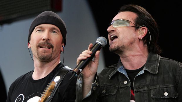 Irish rock stars Bono (R) and The Edge of the band U2 do it all over again at the Live 8 concert in Hyde Park in London, July 2, 2005.