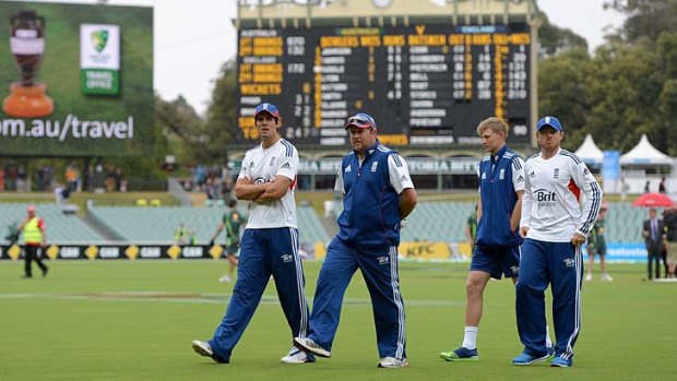England captain Alastair Cook, bowling coach David Saker, Ian Bell and Joe Root wait to warm up before the final day of the second Test.