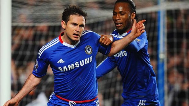 Frank Lampard of Chelsea celebrates scoring his penalty with Didier Drogba.