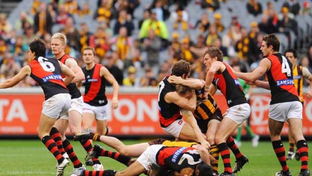 Essendon and Hawthorn players come to grips after Matthew Lloyd's heavy hit on Hawk Brad Sewell during last year's round-22 match at the MCG.