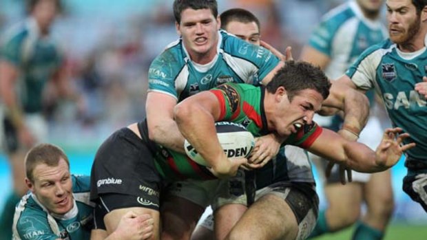 Hard to stop . . . Sam Burgess tests the Panthers' defence.