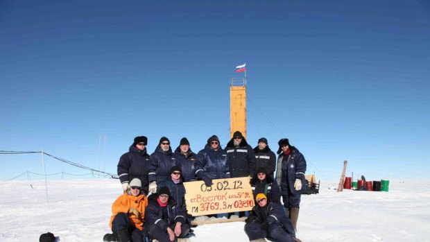 'Like flying to the moon' ... Russian researchers pose for a picture after reaching the subglacial lake Vostok.