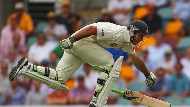 A long stretch: Ricky Ponting loses his bat yesterday at the Gabba.