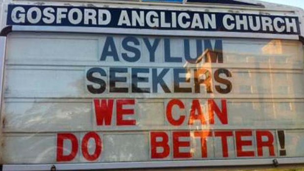 Father Rod Bower's signs on asylum seekers.