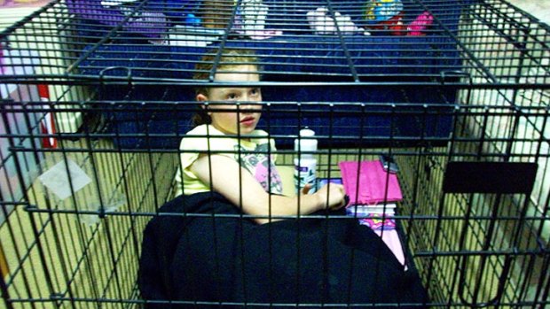 Nerang school girl Sarah Braund locked herself in a cage for a day to bring attention to aminal cruelty.