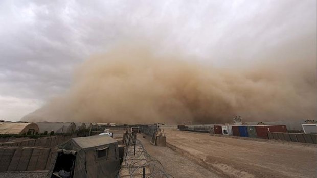 Blind spot: A sandstorm approaches the British forces' Camp Bastion in Helmand province.