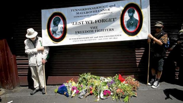 Not forgotten: Two men gather at the burial site at the Queen Victoria Market for two Aboriginal men.