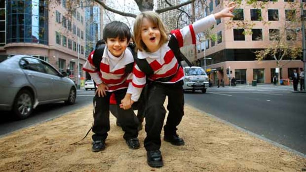 Abbas and Killian both 5, at the front of the new Melbourne City School in King Street.