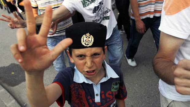 A boy gestures during a protest to support Ratko Mladic in the town of Pale, near Sarajevo.