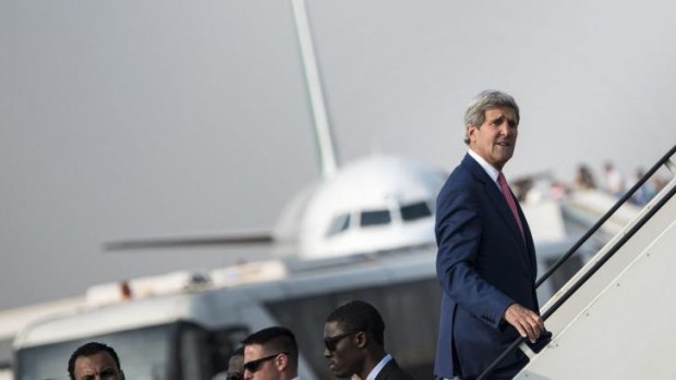 US Secretary of State John Kerry boards his plane at Cairo International Airport after talks with Egyptian President Abdel Fattah al-Sisi.