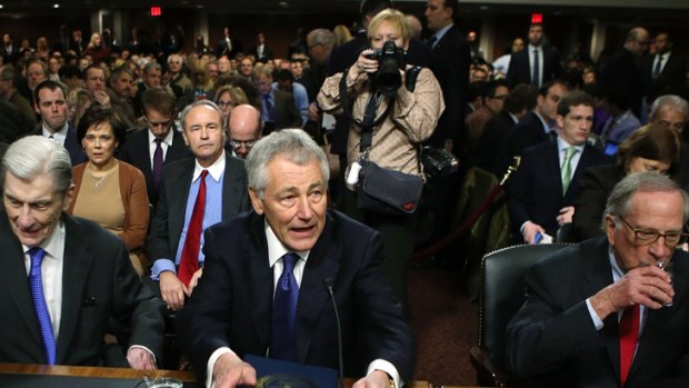 Former US Senator Chuck Hagel takes as he arrives at his confirmation hearing to become the next secretary of defence.